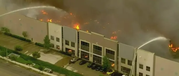 Warehouse fire in Redlands, California showing the consequences of structural steel collapse due to fire Warehouse fire in Redlands, California showing the consequences of structural steel collapse due to fire